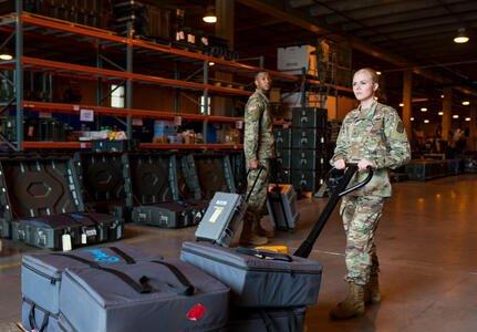 Representation of the US military personnel organizing supplies within their own warehouse.